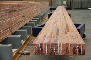 Gluing the blue gum beams for the First Steps Count Centre in Taree